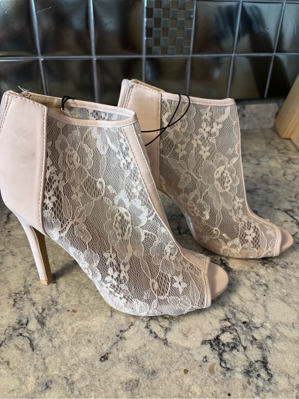 Women's Lace Peep-Toe Stiletto Booties in Blush with flaw